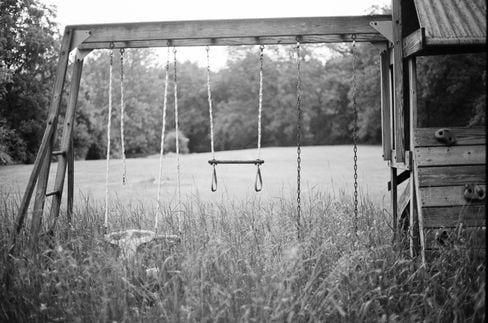 A scan from my first roll of film, an image of an overgrown playground.